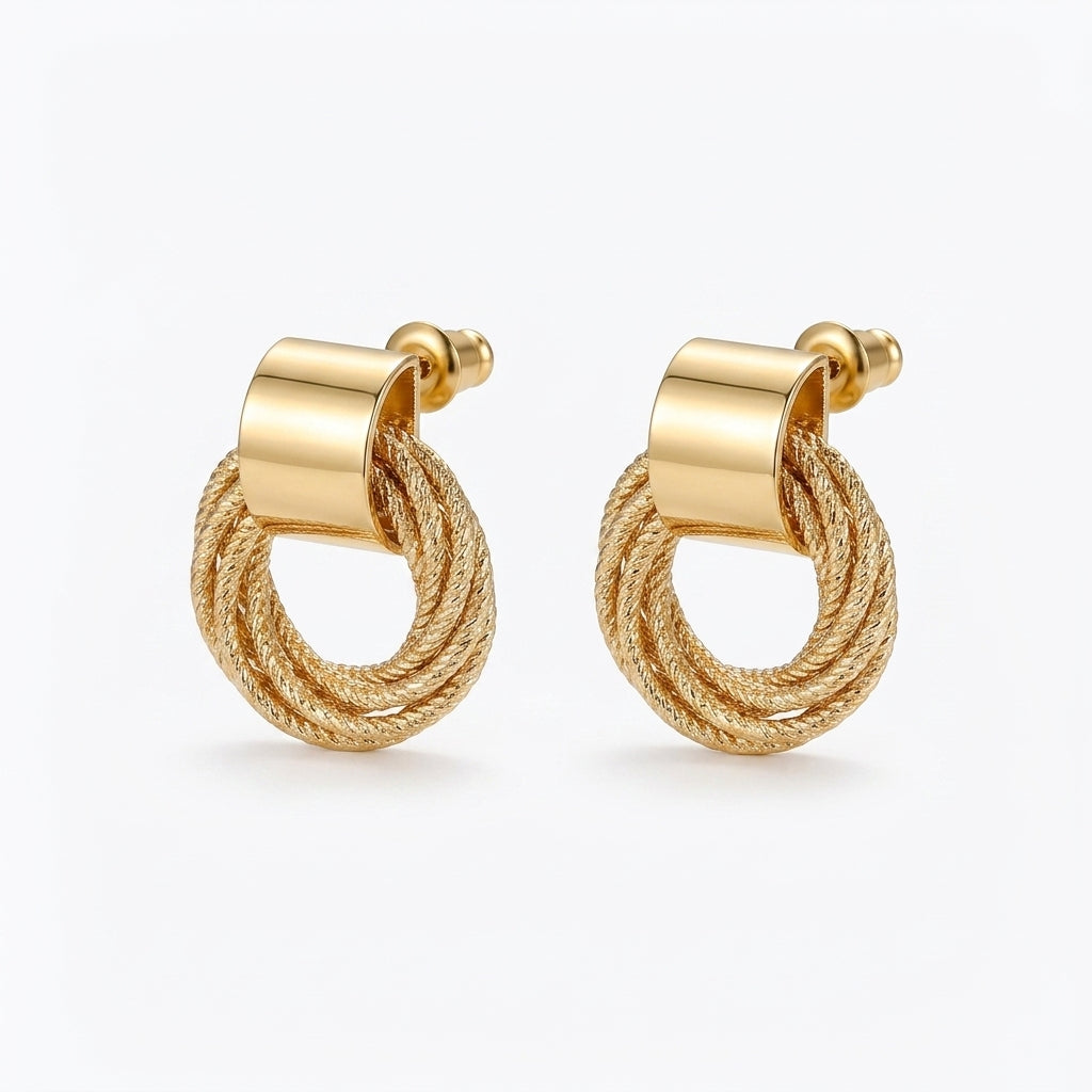 Gold twisted circle stud earrings with woven geometric design